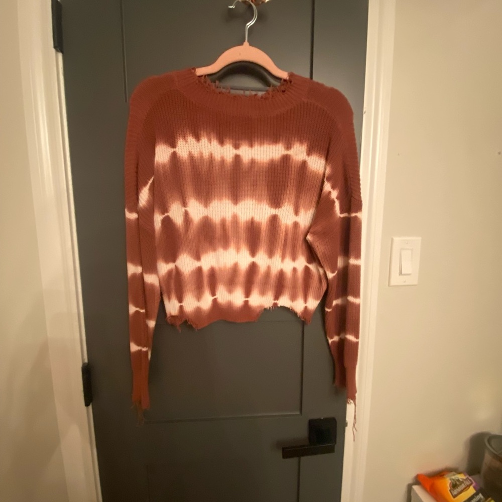 Red and white ripped sweater